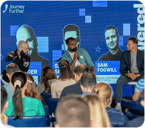 Sandeep Shah talking on stage at a Journey Further event